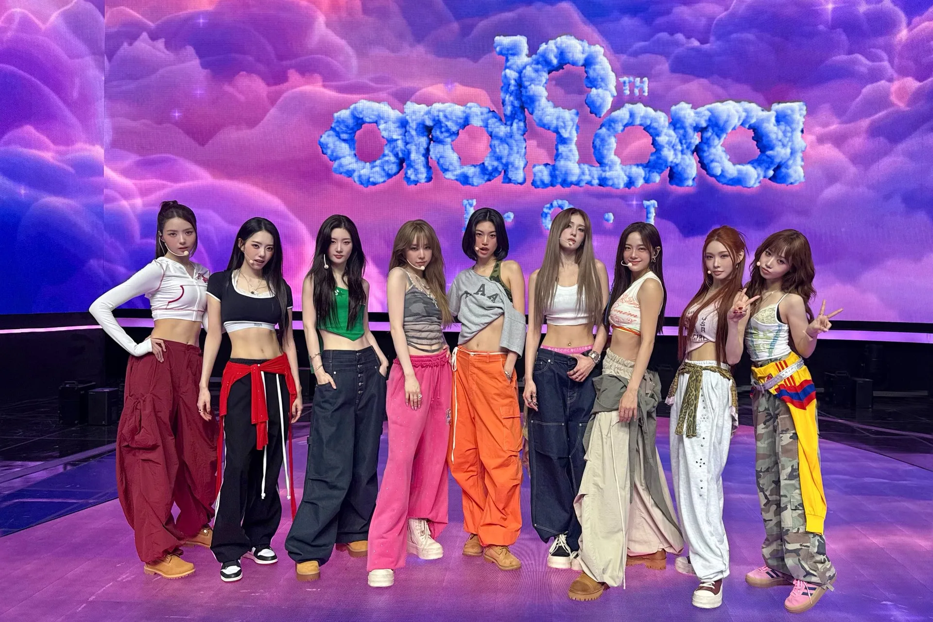 I.O.I — nine reunion members in an official 2026 group photograph