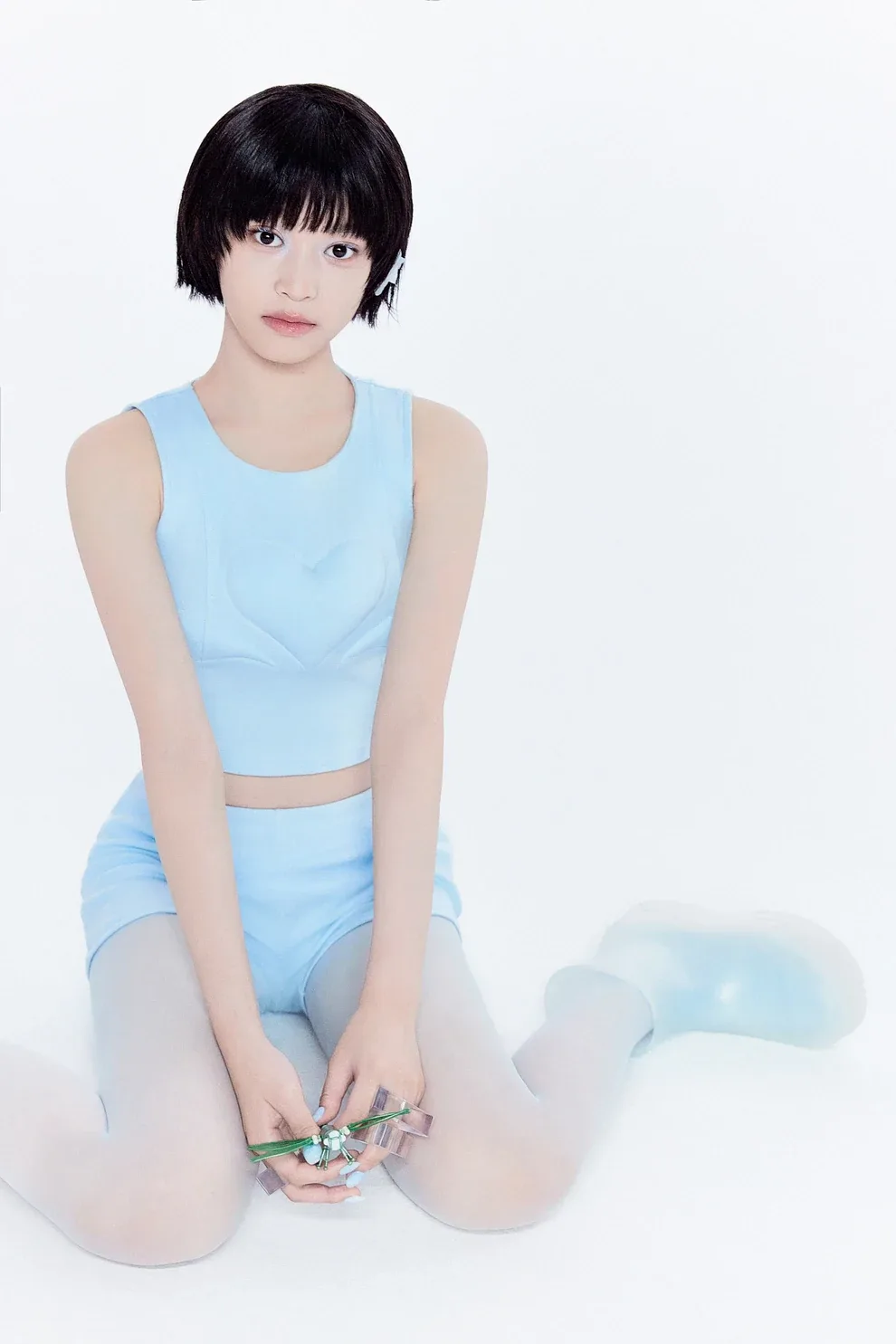 Himeki of A2O LITE kneeling in a light blue outfit with a short black bob, in her official NEON artwork