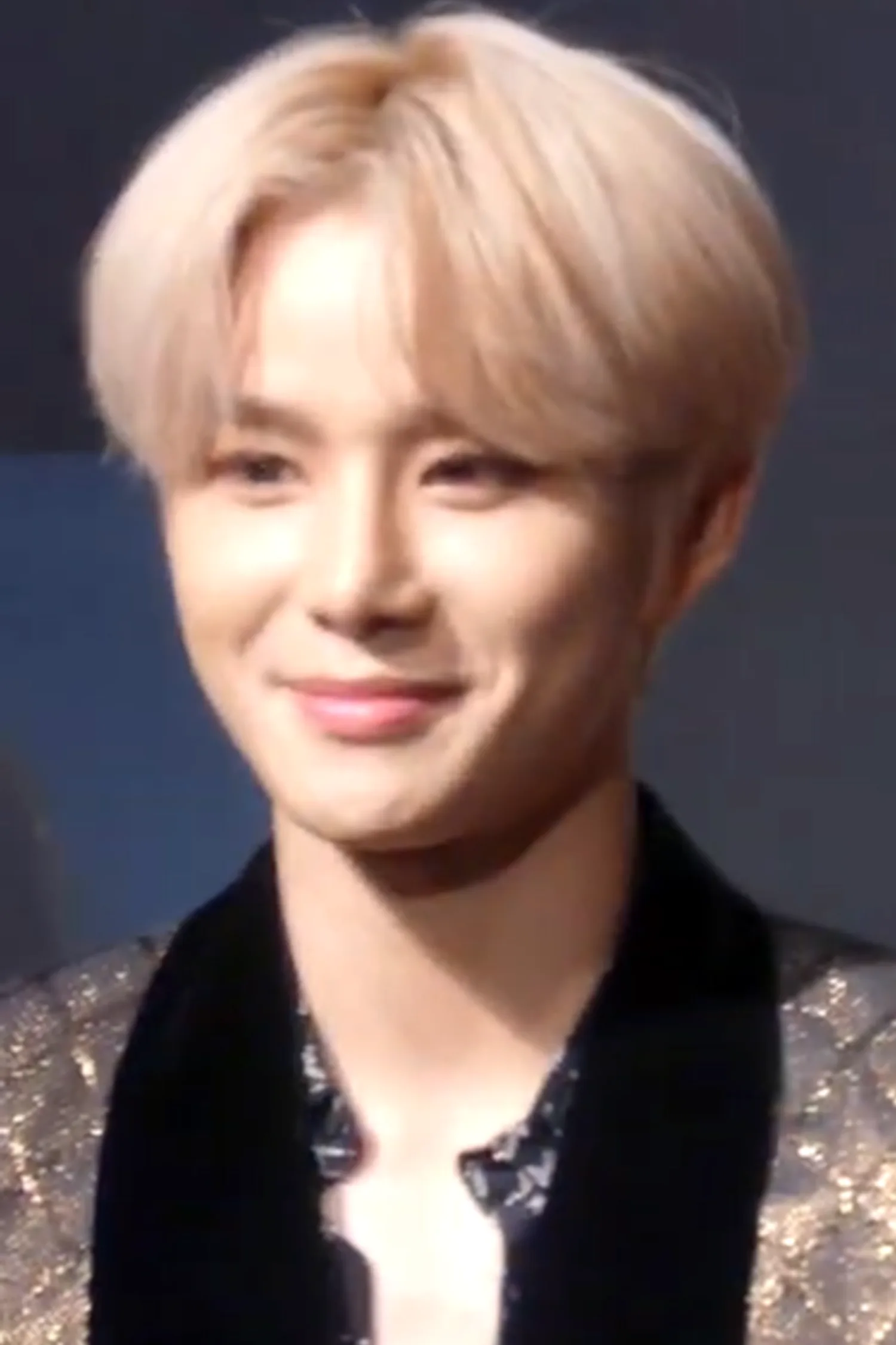 Jungwoo at the We Are Superhuman press conference in May 2019