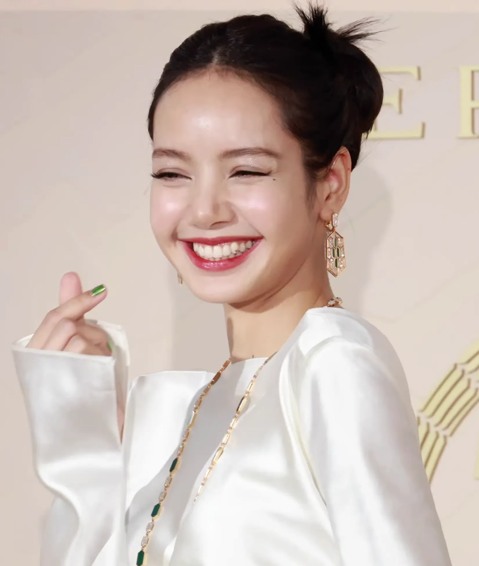 Lisa of Blackpink smiling at a Bulgari photo call in June 2023
