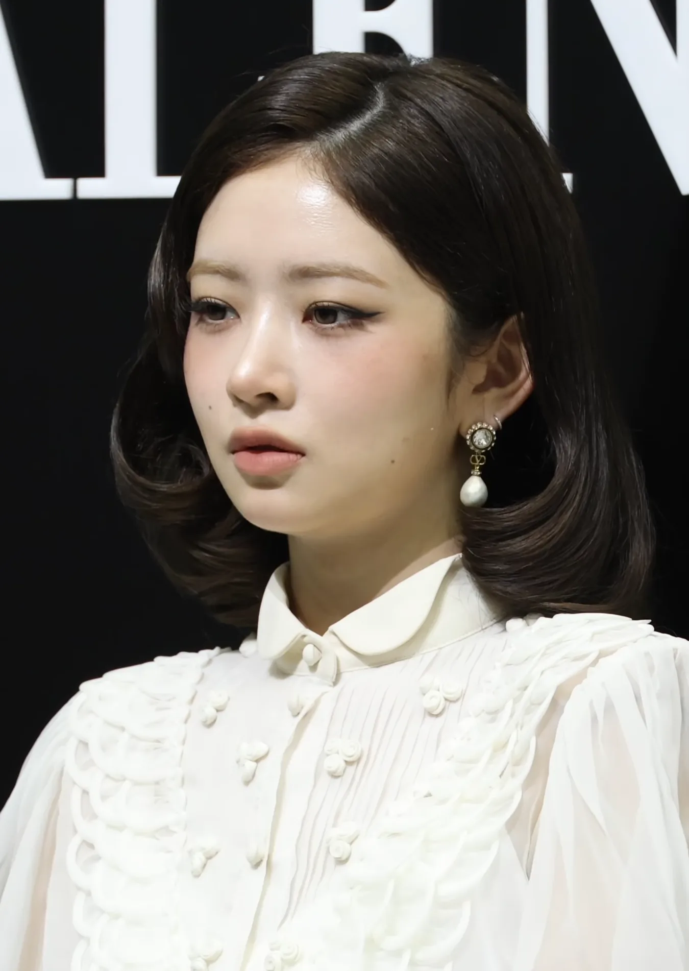 Rei of Ive posing at a Valentino event in March 2026