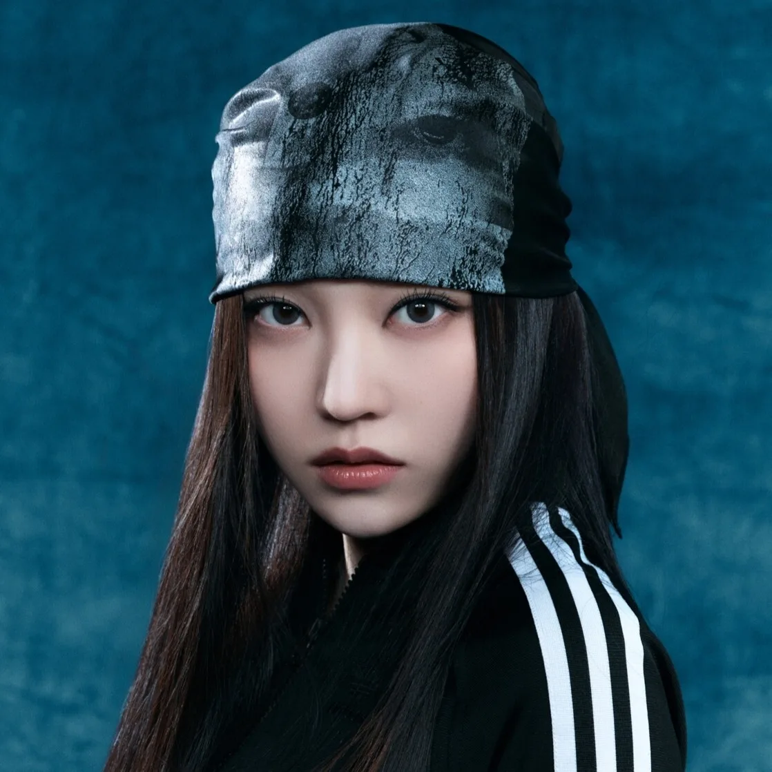 Youngseo of ALLDAY PROJECT in an official blue-background portrait